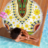 Round white beach blanket with yellow flowers and colorful dashiki V-pattern, with fringe