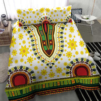White duvet cover with yellow flowers, multicolor vertical motif, and green red border