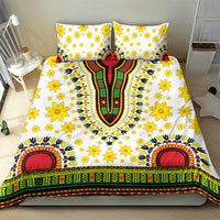 White bedding set with yellow floral print, central dashiki motif, and striped green-red border