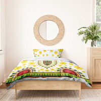 White bedding set with yellow floral print and multicolor dashiki stripe medallion center
