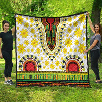 White dashiki-style quilt with yellow flower print, red arch motifs, colorful border