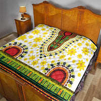 White dashiki quilt with yellow flowers, red oval arches, and multicolor striped edge