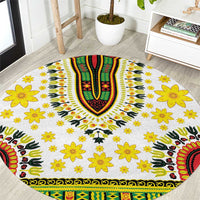 Round white rug with yellow flower motifs and green/red/black dashiki-style center design