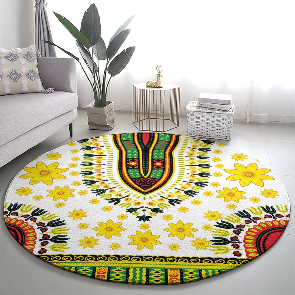 Round white rug with yellow floral pattern and green/red/black dashiki-style banded edge