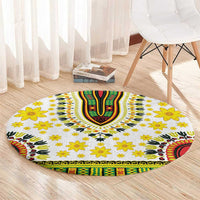 Round white rug with green/red V-shaped center, yellow flowers, and patterned border