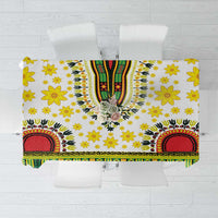 White tablecloth with yellow flowers, green-and-red stripes, and central floral medallion