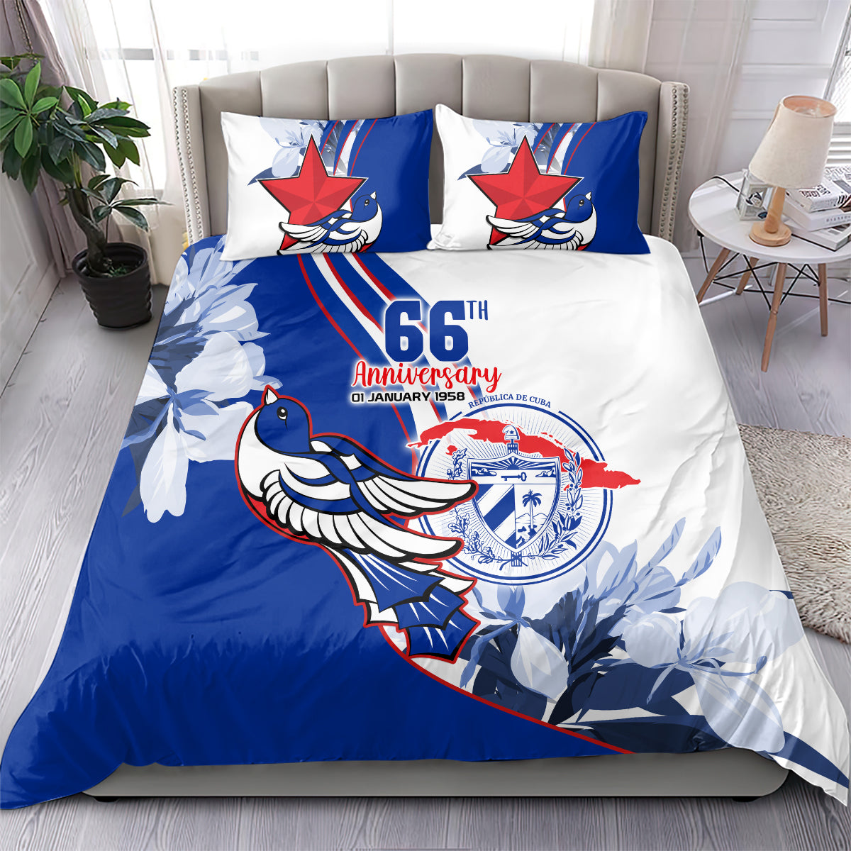 Blue and white printed bedding set with two pillows on bed, bird emblem and 66th graphic