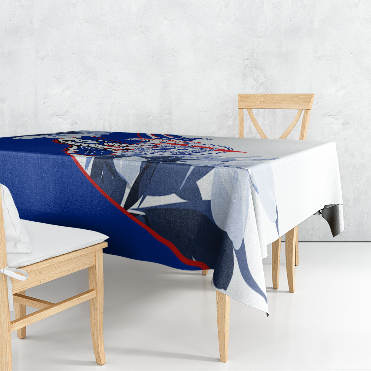 Blue tablecloth with patriotic print, draped over a dining table edge