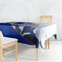 Blue tablecloth with patriotic print, draped over a dining table edge