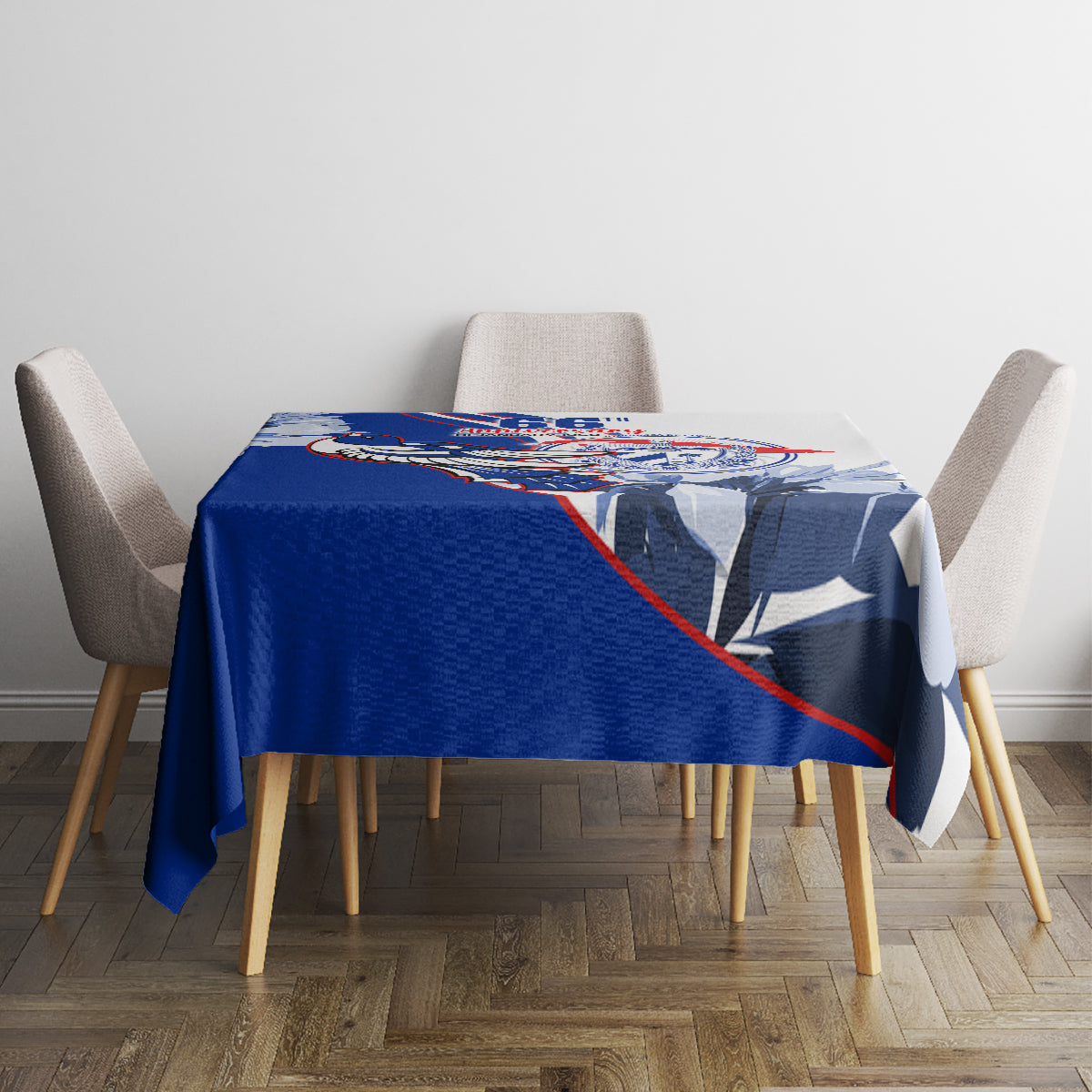 Blue tablecloth with patriotic emblem print across the center of dining table