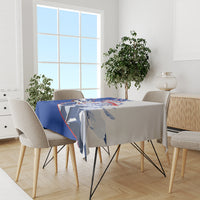 Blue personalized tablecloth covering dining table with patriotic graphic print