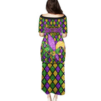 Long glitter Mardi Gras dress with short sleeves; back shows diamond pattern and purple fleur