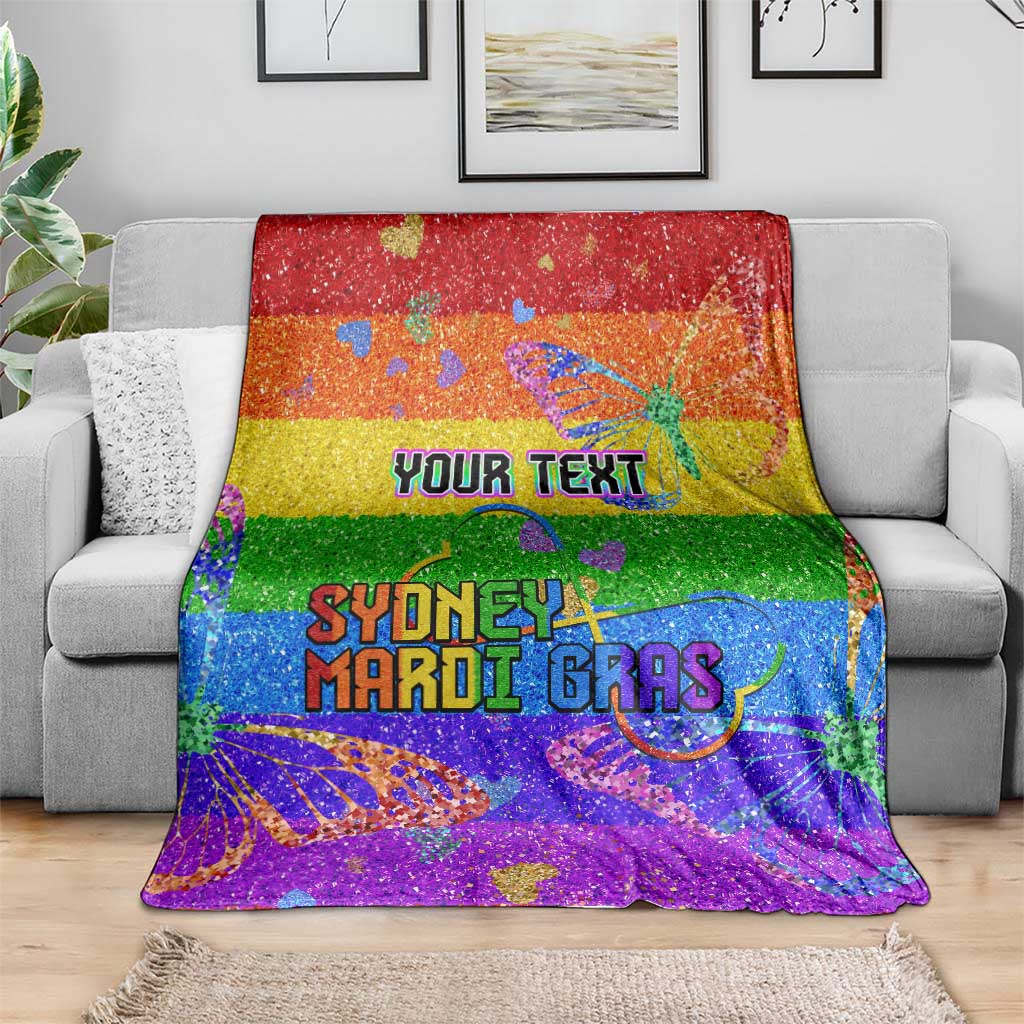 Personalized rainbow glitter blanket draped on couch with “YOUR TEXT” and “SYDNEY MARDI GRAS”