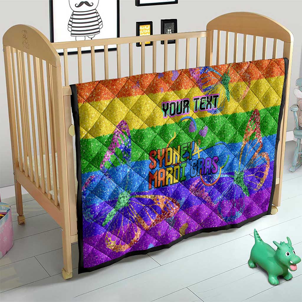 Rainbow glitter baby quilt on a crib with “YOUR TEXT” and “Sydney Mardi Gras” butterflies