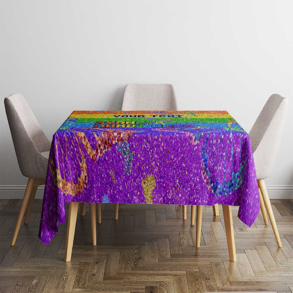 Rainbow glitter pride tablecloth over rectangular table with colorful center pattern