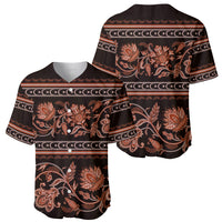 Dark baseball jersey close-up view with orange floral ornament and patterned side panels