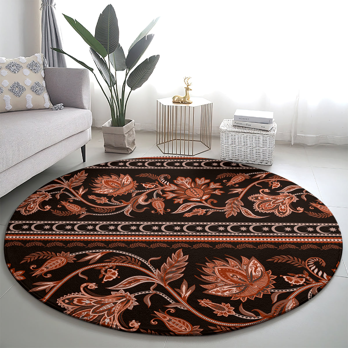 Round traditional patterned carpet with ornate orange damask flowers on dark base