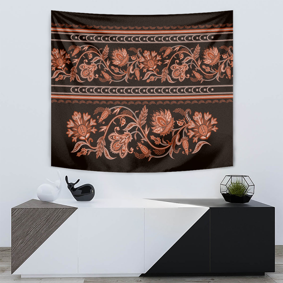 Hanging tapestry with orange floral scrolls on dark fabric and gold banding