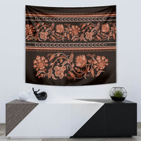 Hanging tapestry with orange floral scrolls on dark fabric and gold banding