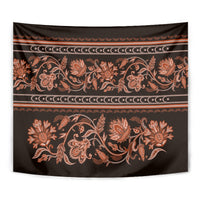 Close-up tapestry with orange floral buta ornament on dark fabric and gold stripes