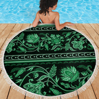 Green circular beach blanket with tassel fringe, floral and vine ornament band