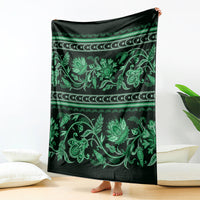 Green and dark patterned throw blanket with ornate floral and Buta motifs