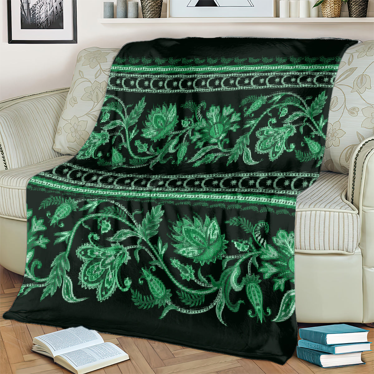 Green and dark throw blanket with large floral vines and decorative border
