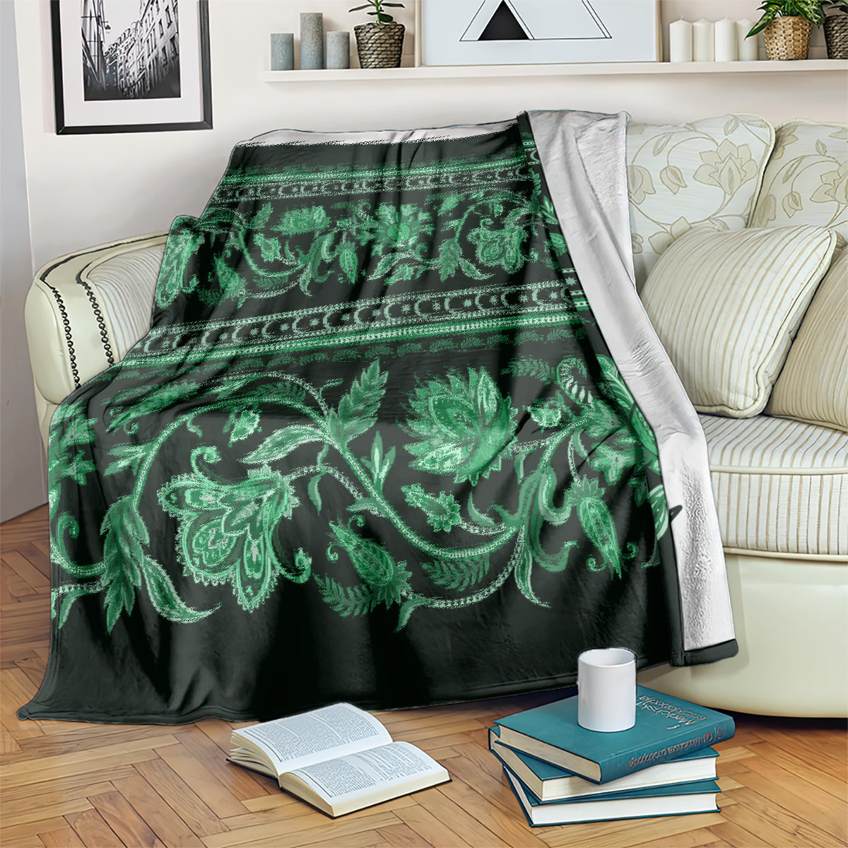 Green floral ornamental throw blanket draped on a light sofa