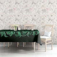 Green traditional tablecloth with floral buta pattern, centered on dining table