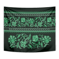 Green traditional tapestry close-up with floral buta vine ornament and striped bands