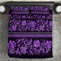 Violet bedding set with ornate floral buta pattern and two matching pillowcases
