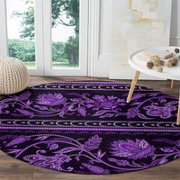 Violet round carpet with large purple floral medallions and ornate vine pattern