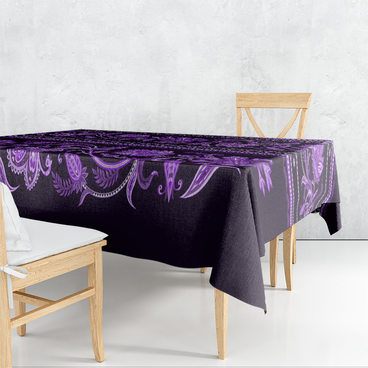 Violet tablecloth draped on table, with ornate floral pattern