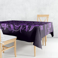 Violet tablecloth draped on table, with ornate floral pattern
