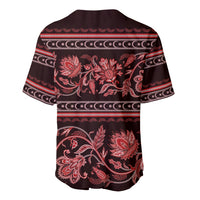 Back view of red and dark baseball jersey with floral ornament and striped trim