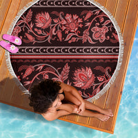 Round beach blanket with fringed edge, red floral paisley pattern and central wave