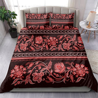 Red traditional floral bedding set with horizontal border stripes and two matching pillowcases