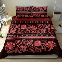 Red floral patterned bedding set with decorative border stripes and two pillowcases
