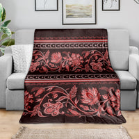 Traditional patterned throw blanket, red floral paisley design with striped border
