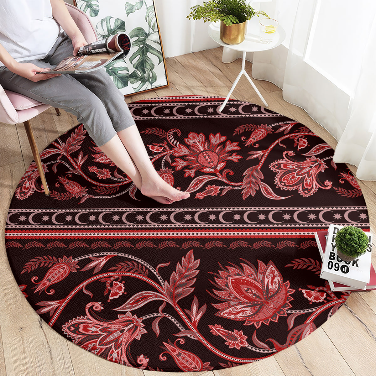 Round red patterned carpet with large floral medallions and central buta design