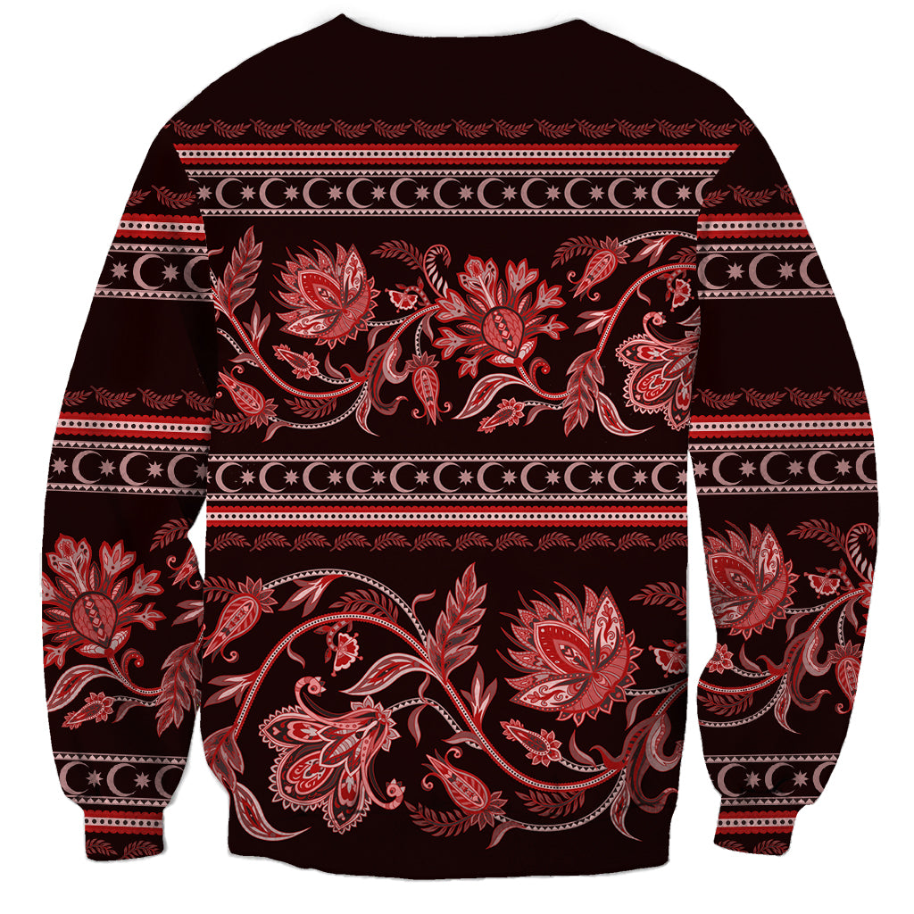 Crewneck sweatshirt with red floral paisley-style buta pattern across front