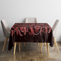 Square dining tablecloth with dark background, red floral border, and traditional motifs