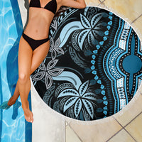Round beach blanket close-up showing blue and black mandala print and white fringe