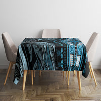 Square blue and black tribal patterned tablecloth covering table with geometric stripe details