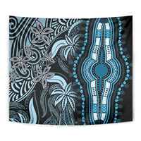 Blue and black tapestry showing beaded hand emblem with surrounding floral patterns