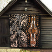 Dark dashiki quilt hung in shelter, showing gold teardrop medallion and ornate stripes