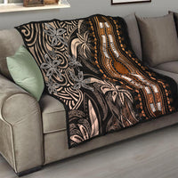 Dark dashiki quilt on sofa with gold medallion, beige floral patterns, and striped trim