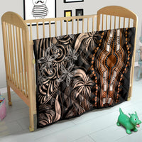 Dark dashiki quilt in a child bed with gold teardrop medallion and tribal pattern