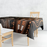 Dark tablecloth with tribal dashiki pattern in gold, brown, and cream