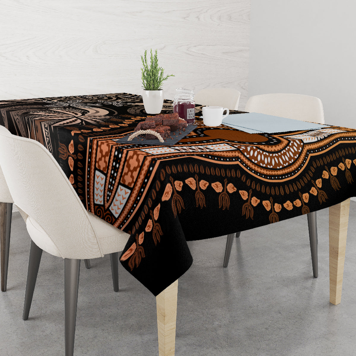 Rectangular tablecloth draped on tabletop; dark base with gold and geometric motifs